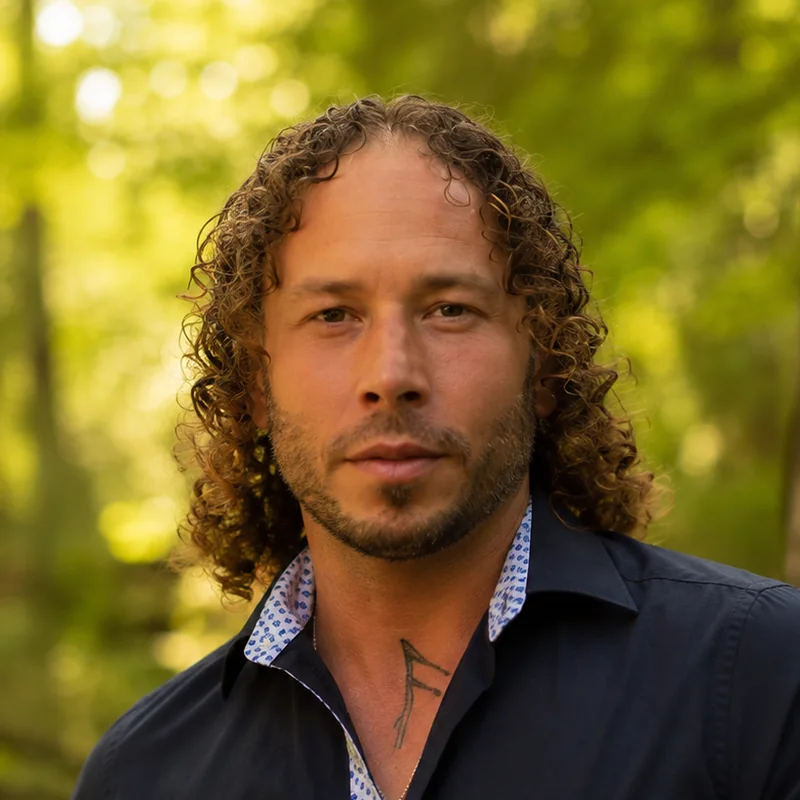 Portrait of Kai Alex outdoors in a forest